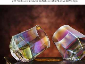 two iridescent glasses laid on their side