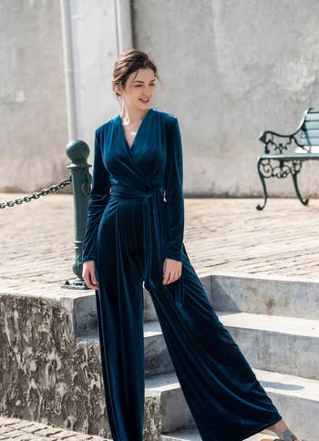 front of model wearing the blue velvet jumpsuit