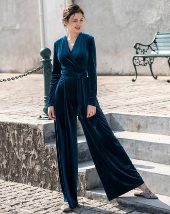 front of model wearing the blue velvet jumpsuit