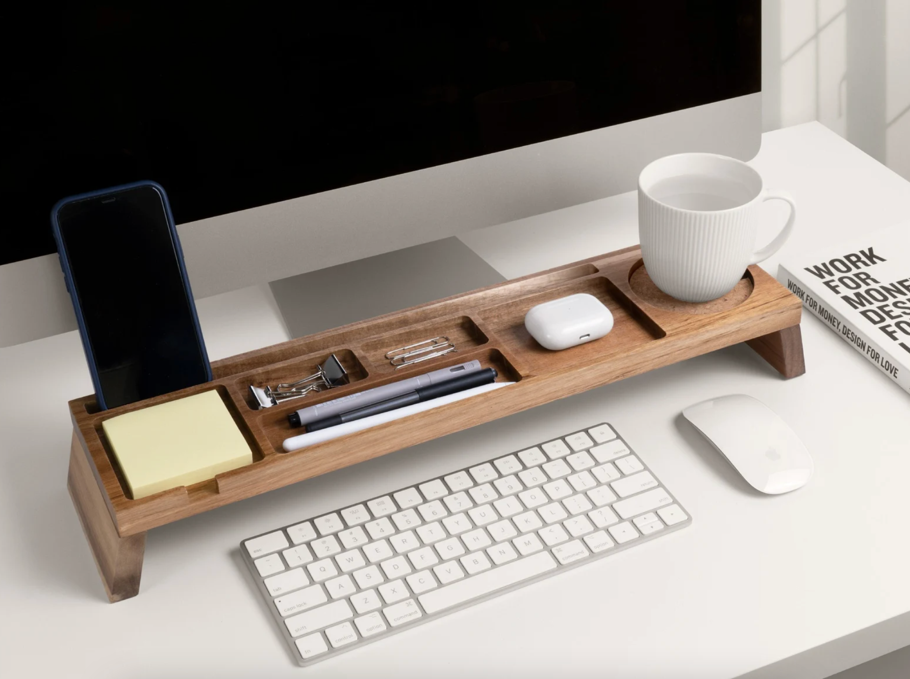 the wood desk organizer over a keyboard on a desk