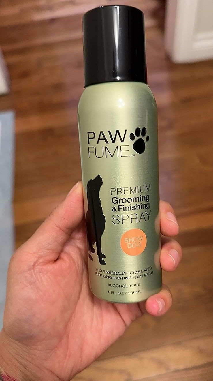 Reviewer holding the spray