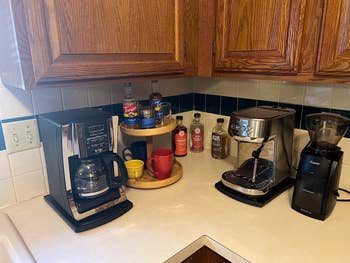 Kitchen counter with various coffee-making appliances and accessories