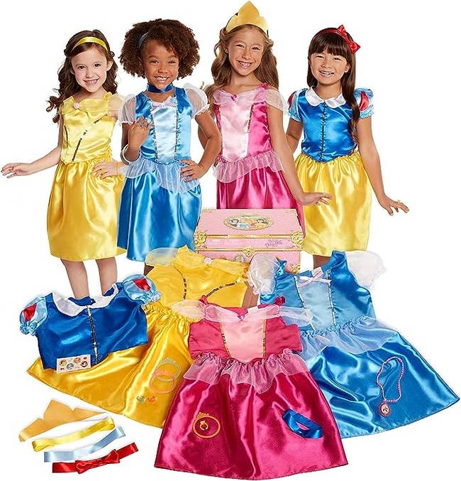 children dressed up in disney princess play dresses