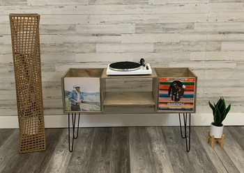 Brown wide wooden record player stand with vinyls in side cubbies