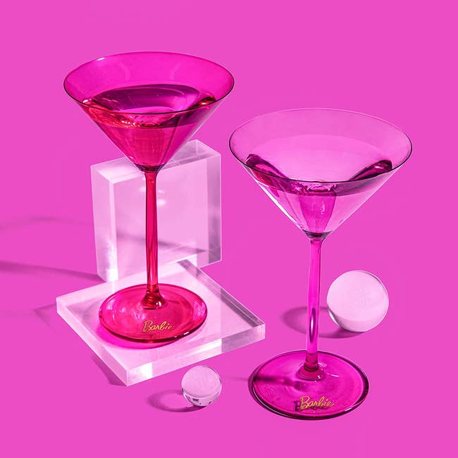 One hot pink and one light pink stemmed translucent martini glass with a small Barbie label on the base 