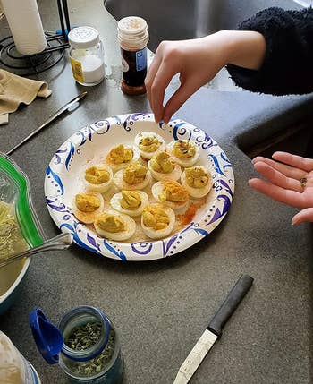 reviewer making deviled eggs