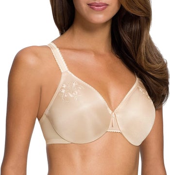 Front of model wearing the seamless nude minimizer bra with tiny floral detailing