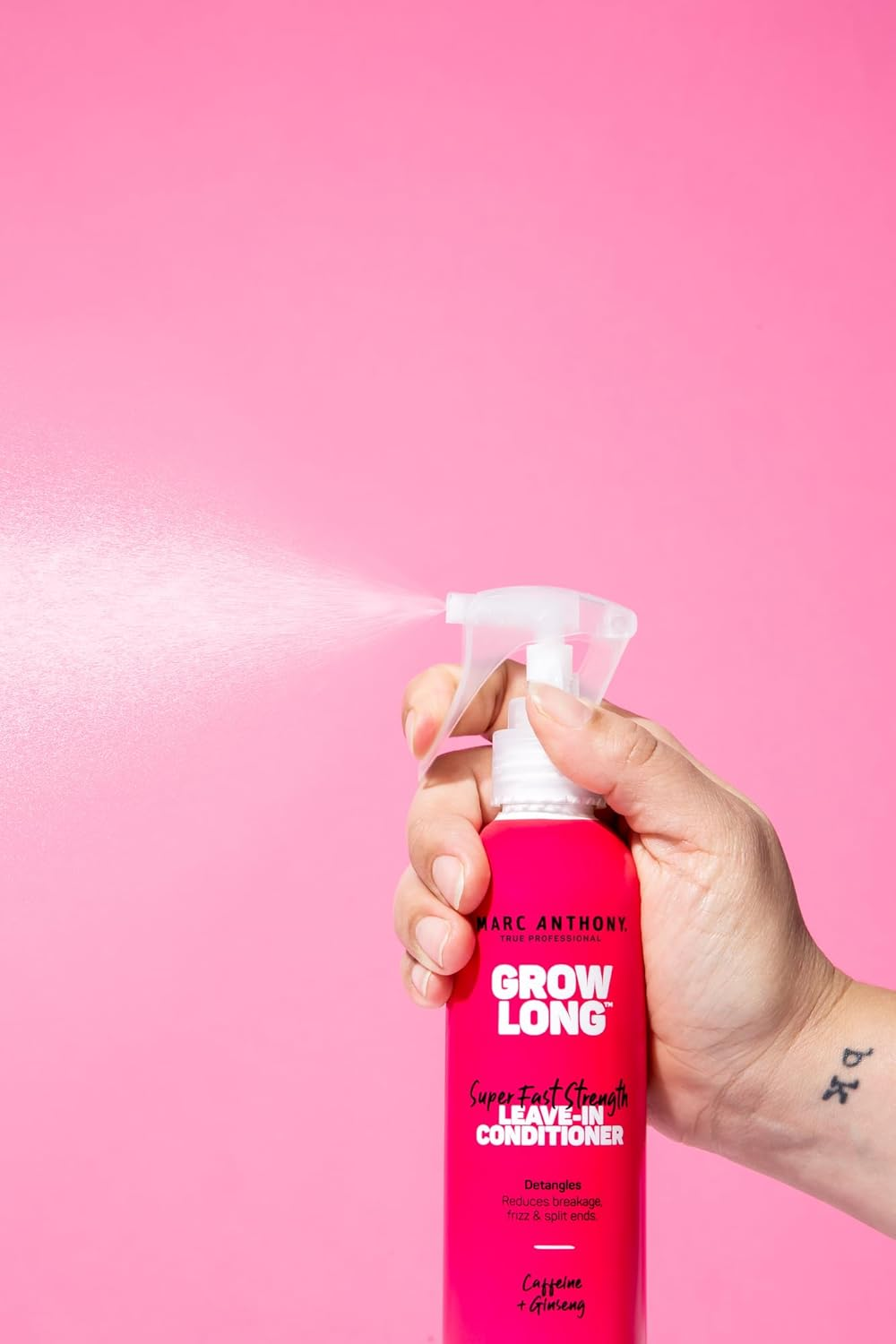 Hand sprays Marc Anthony Grow Long leave-in conditioner, highlighting product use