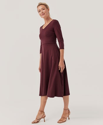 Model in V-neck maroon 3/4-sleeve midi dress 