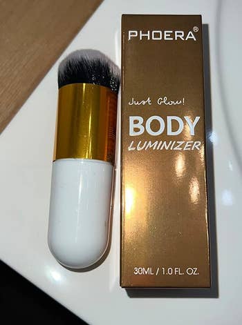 Reviewer photo of the shimmer oil and the included brush