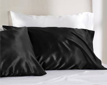 black satin pillowcases on a bed