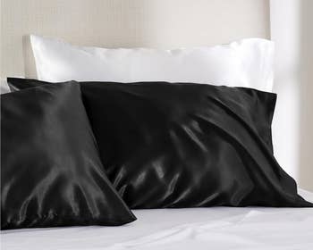 black satin pillowcases on a bed