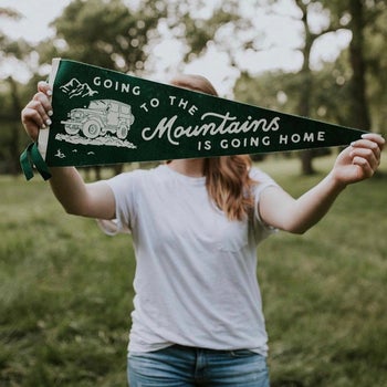 a model holding the pennant which reads 