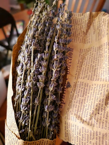 reviewer photo of a lavender bundle wrapped in newspaper