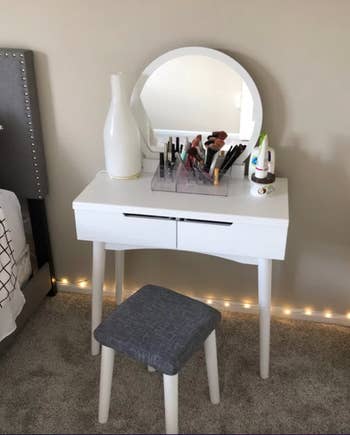 reviewer photo of the white vanity in a bedroom