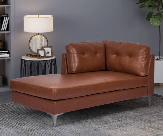 the cognac colored faux leather chaise