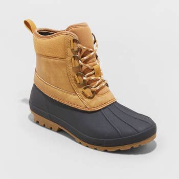 a tan and black winter duck boot