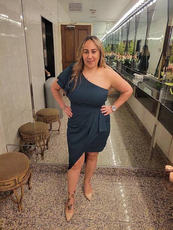 reviewer wearing the dress in teal
