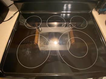 A achromatic  electrical  stovetop featuring 5  circular heating elements