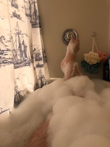 a reviewer in a bubble bath