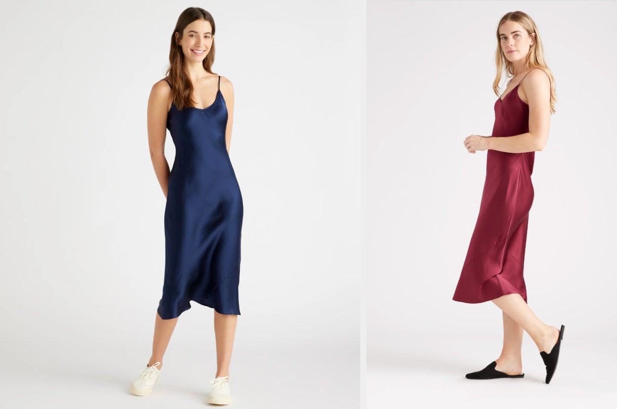 Model wearing navy blue V-neck silk midi dress with white tennis sneakers, model showing side view of product in red with black flats on