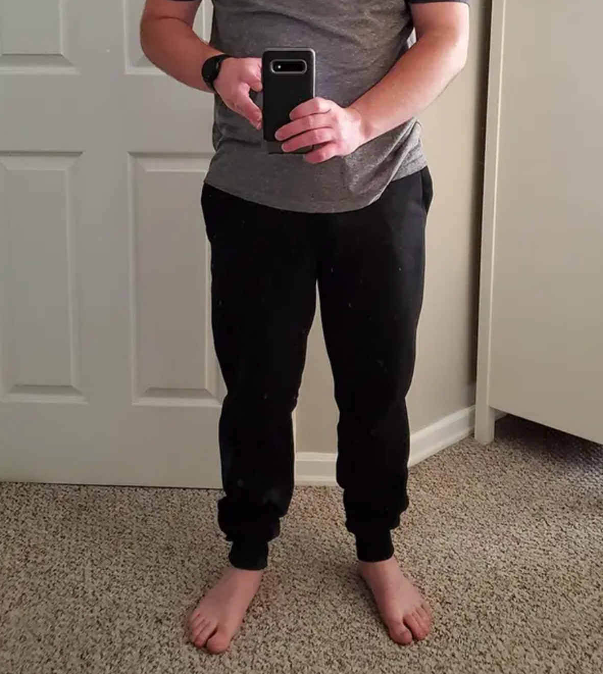 reviewer selfie wearing the joggers in black