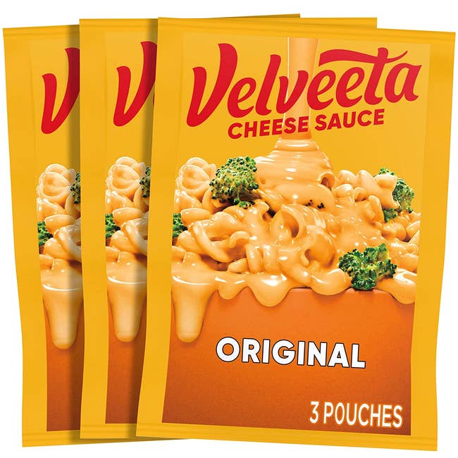 three pouches of cheese sauce