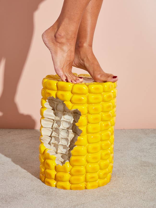 model on the cylindrical corn stool