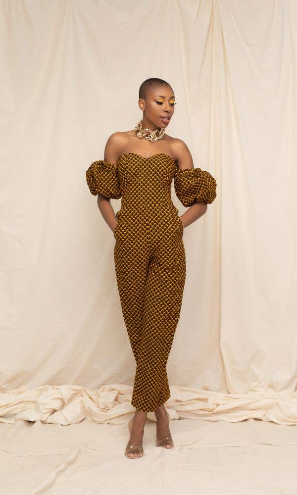 model in yellow and black print jumpsuit with puff sleeves