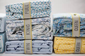 Folded bedding in various patterns, labeled 