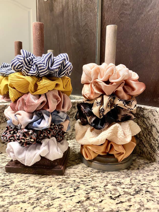 a square shaped and a round shaped scrunchie stand with scrunchies on each one
