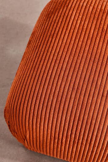 Textured cushion with ribbed fabric, ideal for home decor