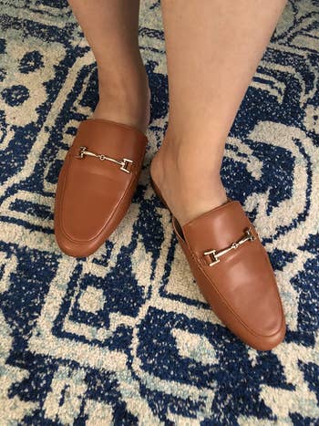 reviewer wearing the loafers in brown