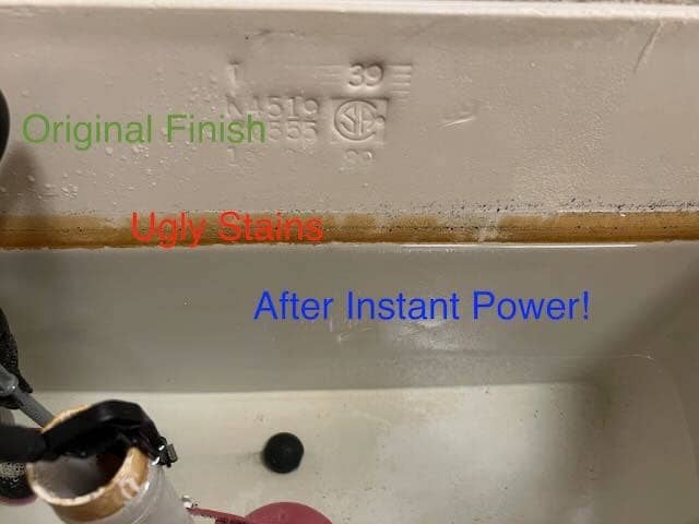 empty toilet tank with visible part where it's cleaned with the cleaner