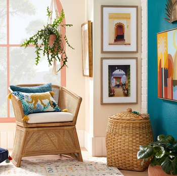 a living room with the pillow sitting on a wicker armchair 