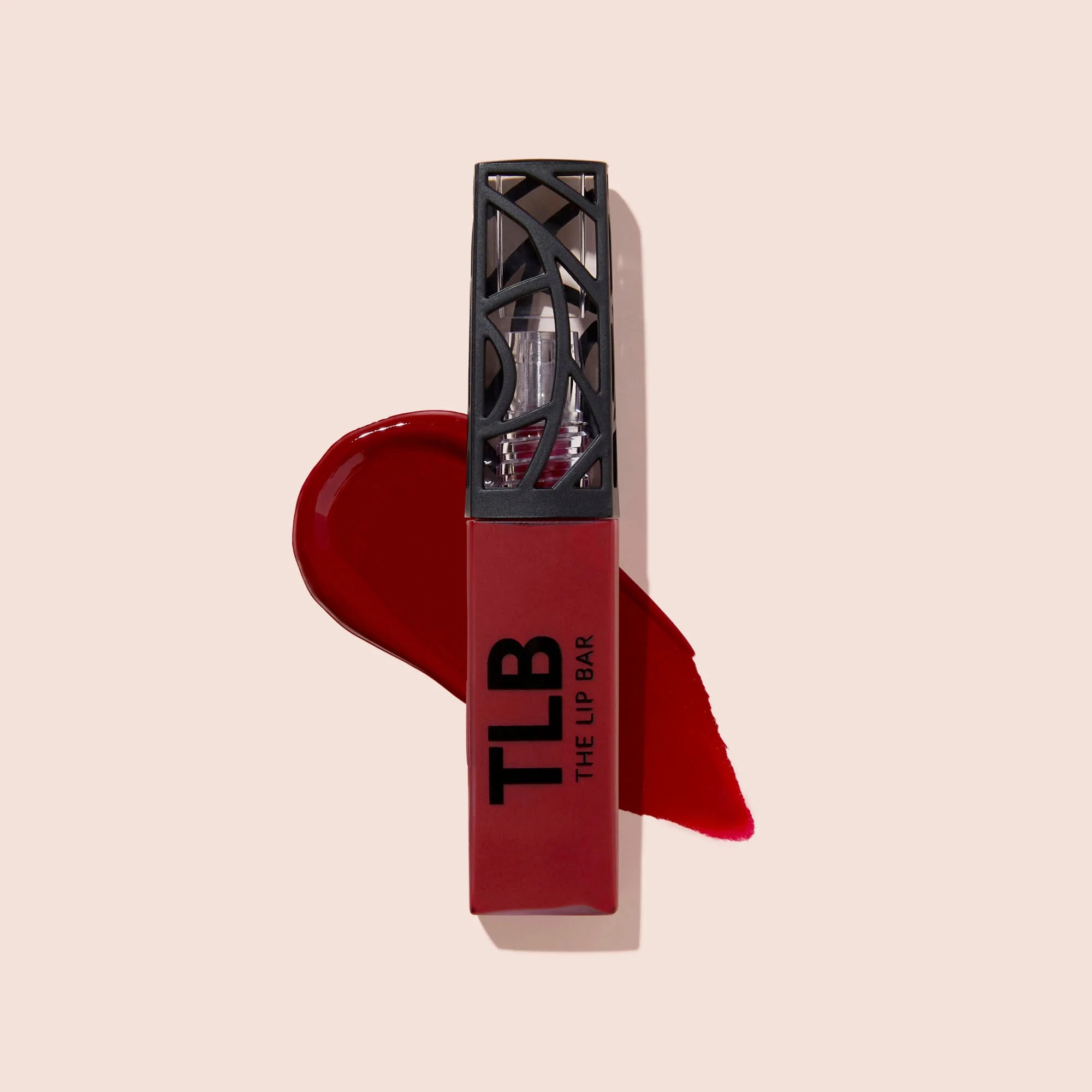 a conduit  of the reddish  matte lipstick 