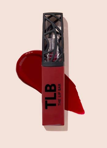 a conduit of the reddish matte lipstick