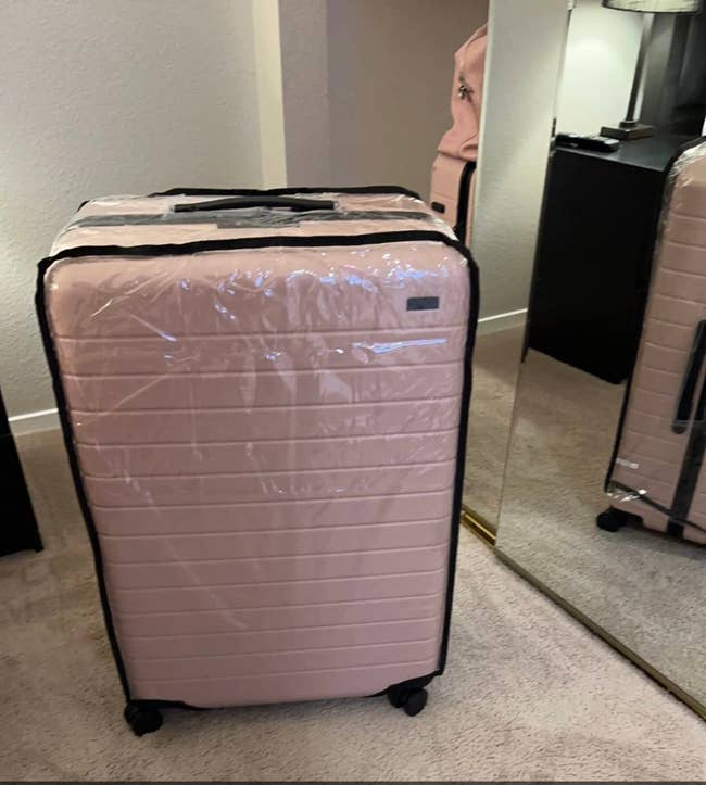 a suitcase with the PVC plastic covering on it
