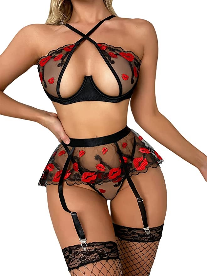 model wearing black mesh lingerie set with red lips printed all over