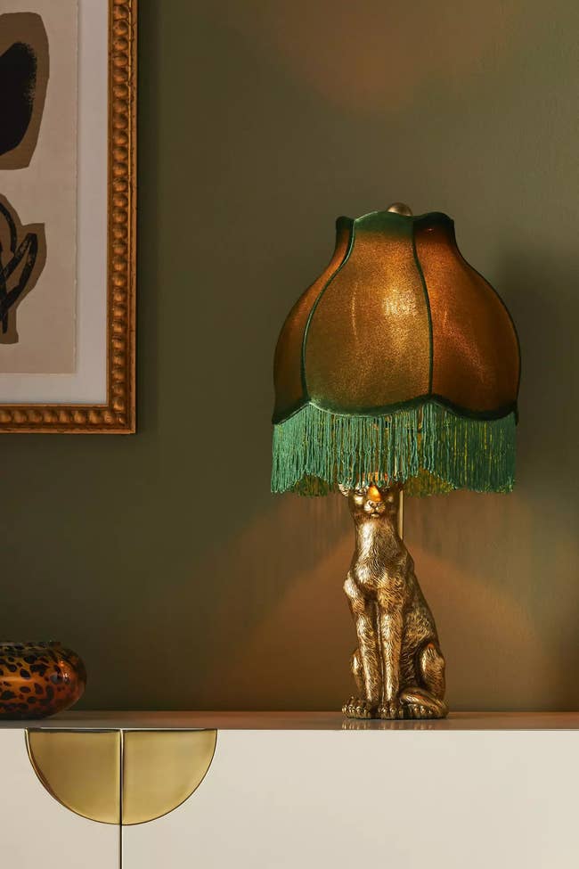 golden leopard table lamp with a vintage lamp shade