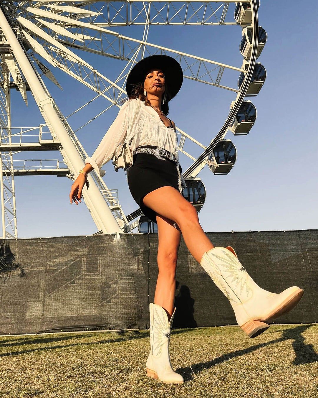 Model wearing white boots