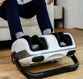 Person using a foot massager while seated
