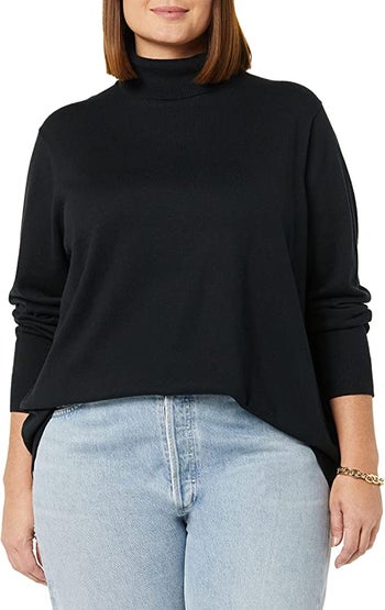 model wearing the black turtleneck with jeans