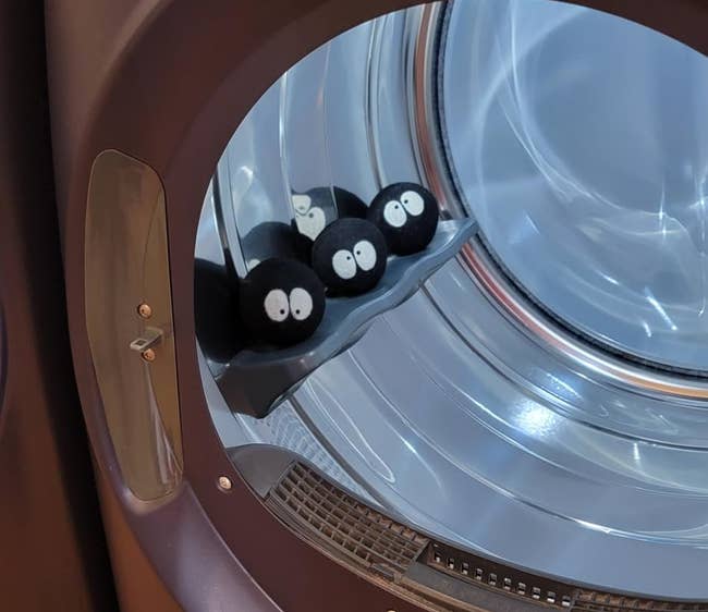 Wool dryer balls with cartoon eyes beryllium wrong an unfastened dryer, acceptable for use
