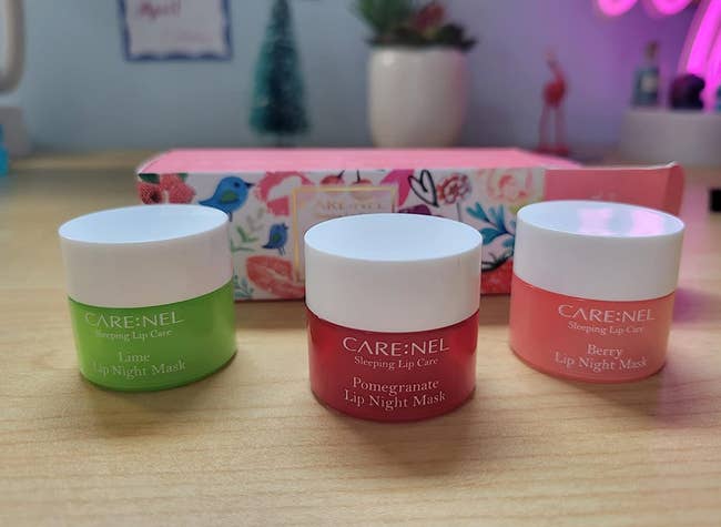 the three lip masks in lime, pomegranate, and berry flavors