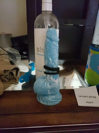 Blue dildo with dual cock ring on it