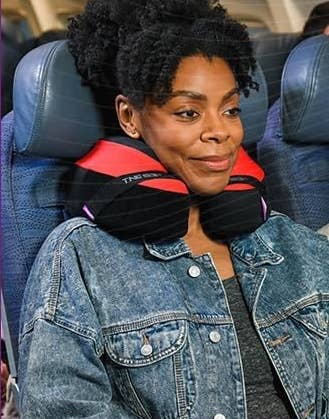 Model on place using travel pillow