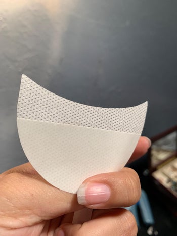 a reviewer holds up ht e shadow patch