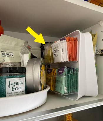 same reviewer's organizer stored neatly in a cabinet taking up much less space than tea boxes