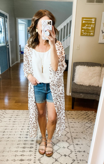 Reviewer wearing cardigan as with jeans and a tank